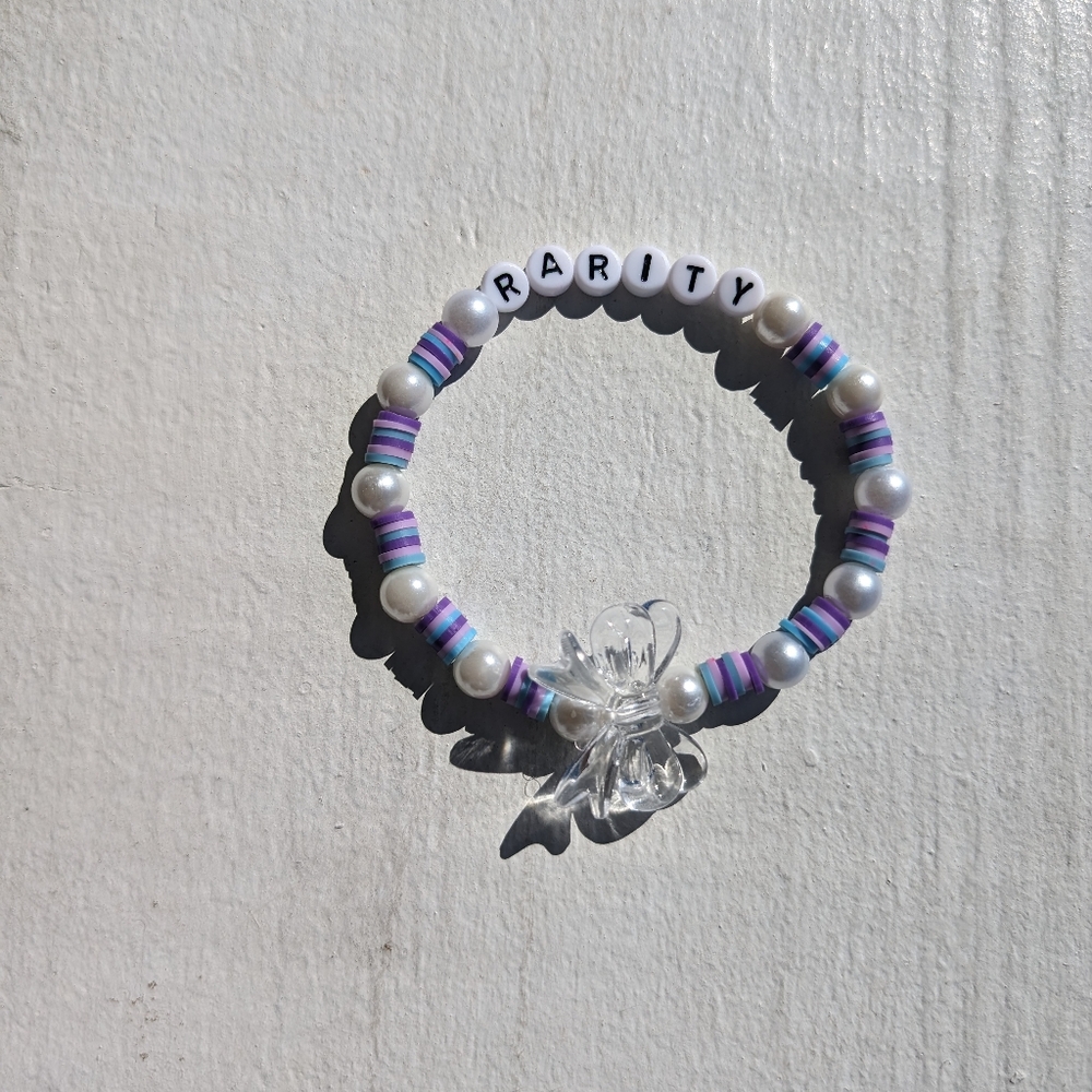 Bows Bracelet, 8.5 inches, dark purple, light purple, & blue beads & clear bow